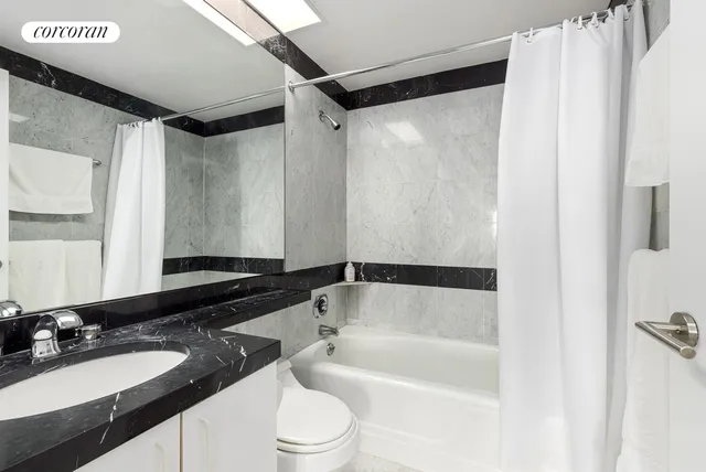 a kitchen with a sink a counter and cabinets