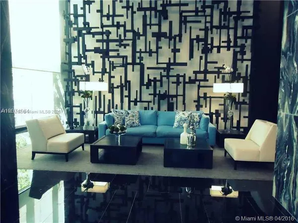 a living room with couches and a potted plant on coffee table