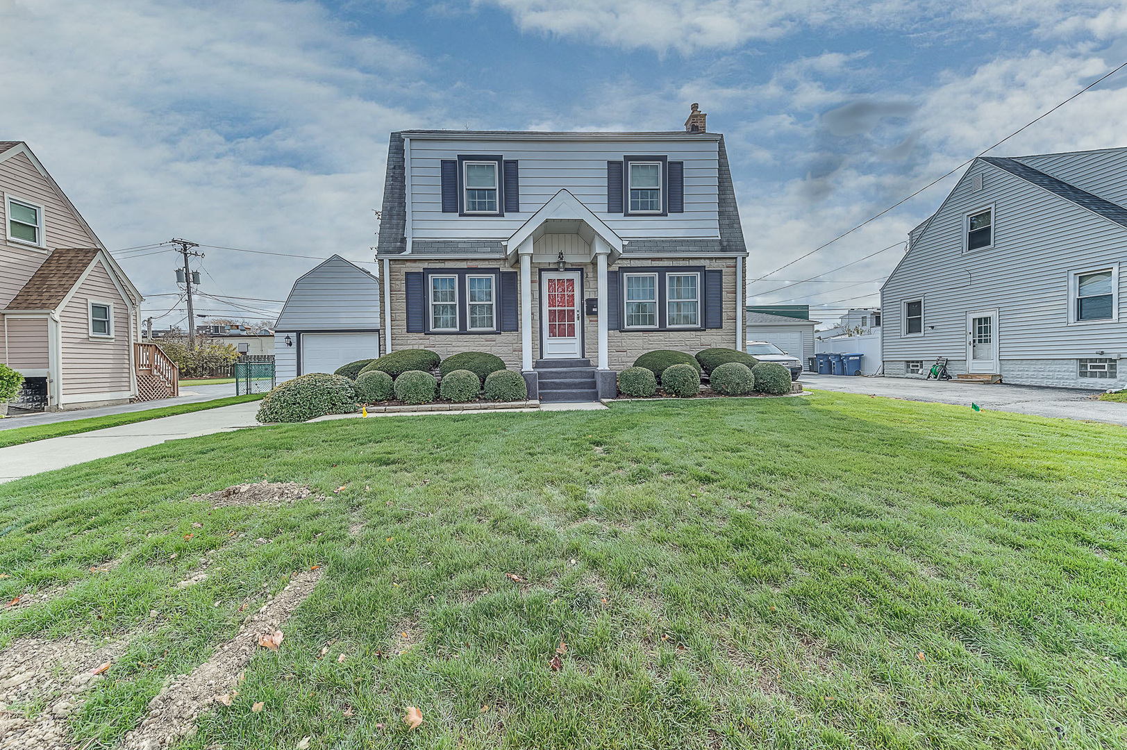 a front view of a house with a yard