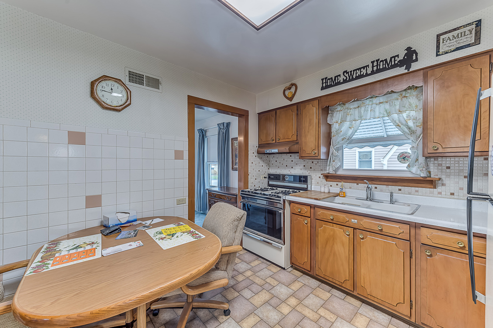 159 Parkview Drive Northlake, IL 60164 - Photo 11 of 24 a kitchen with stainless steel appliances granite countertop a sink dishwasher a stove a refrigerator a microwave oven with cabinets and wooden floor