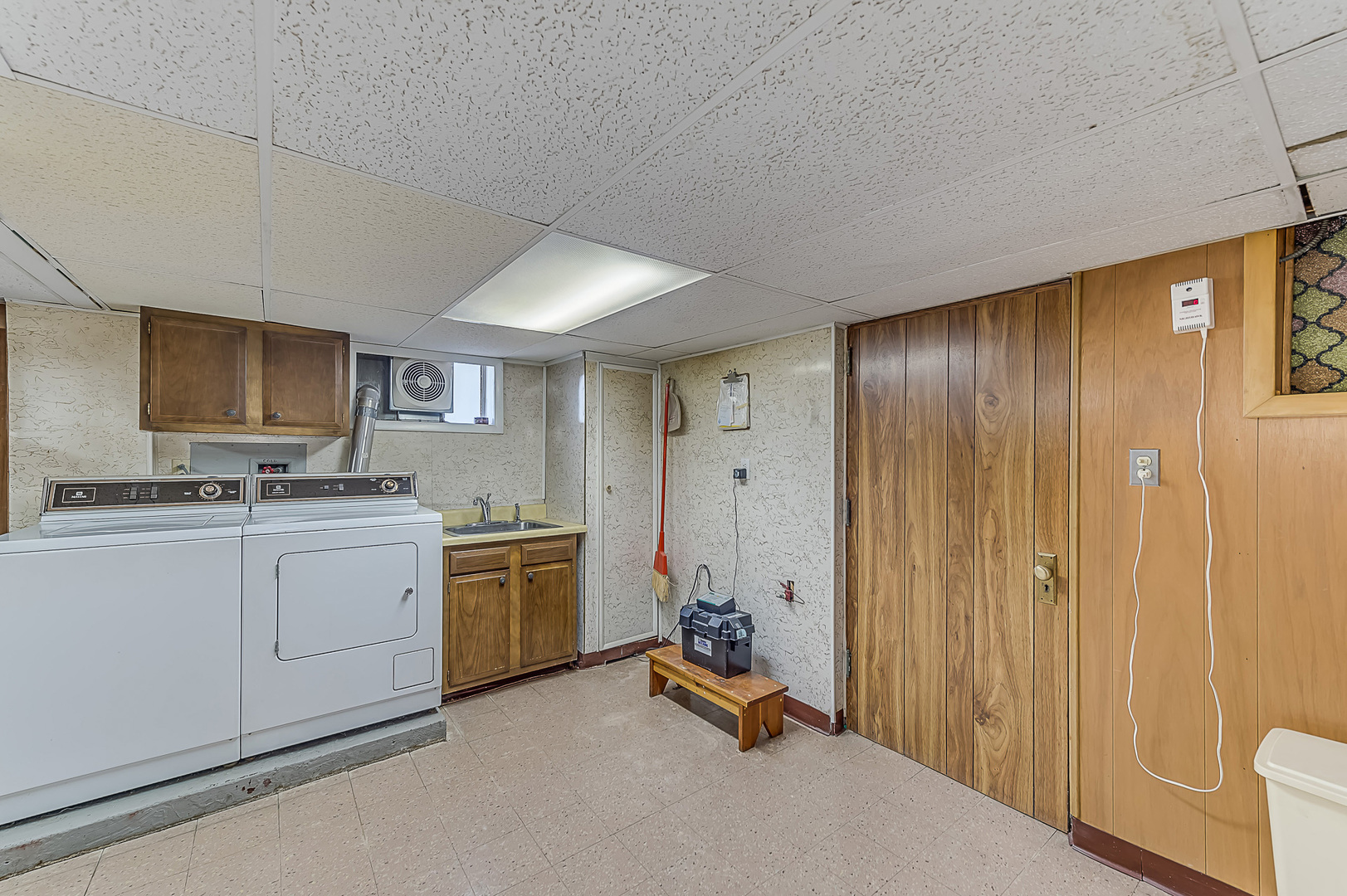 159 Parkview Drive Northlake, IL 60164 - Photo 22 of 24 a view of a kitchen with a sink and dishwasher a refrigerator with white cabinets