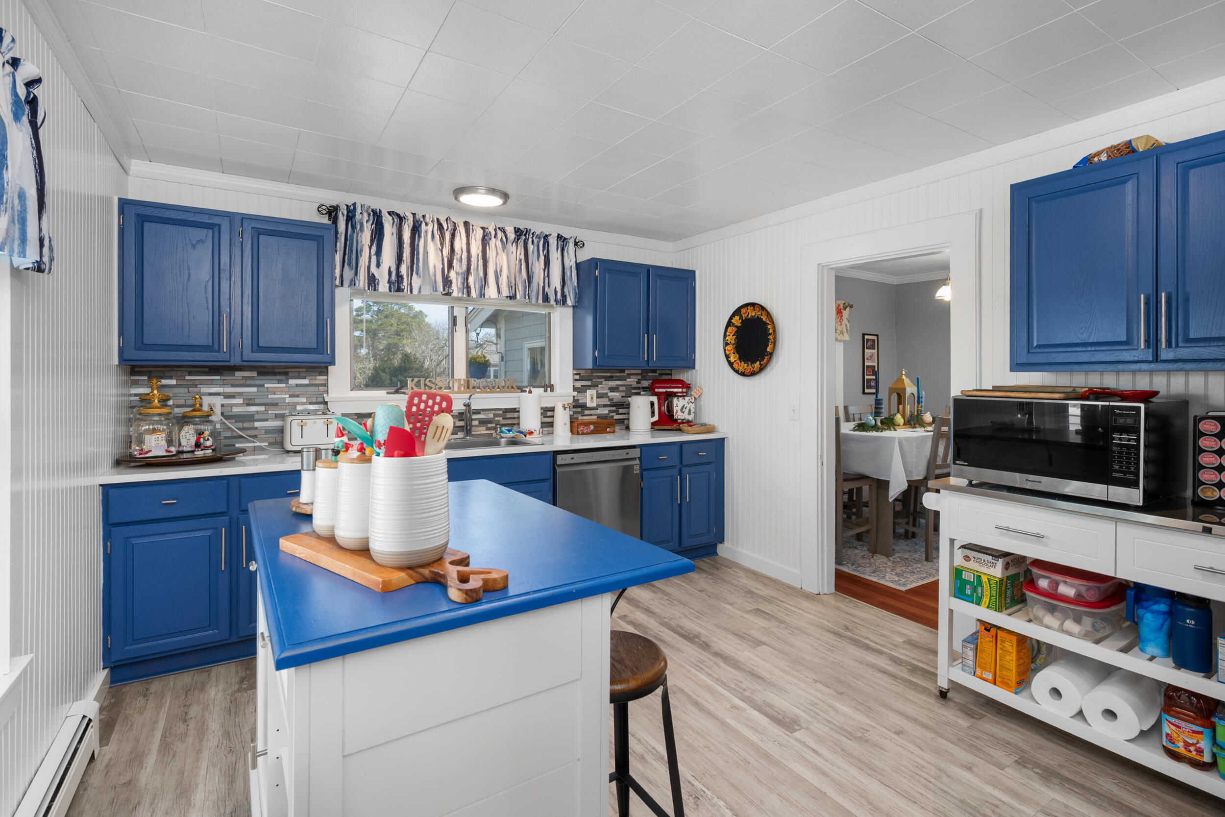 27 Head Of The Bay Road Buzzards Bay, MA 02532 - Photo 13 of 43 a kitchen with stainless steel appliances granite countertop a sink dishwasher stove and cabinets
