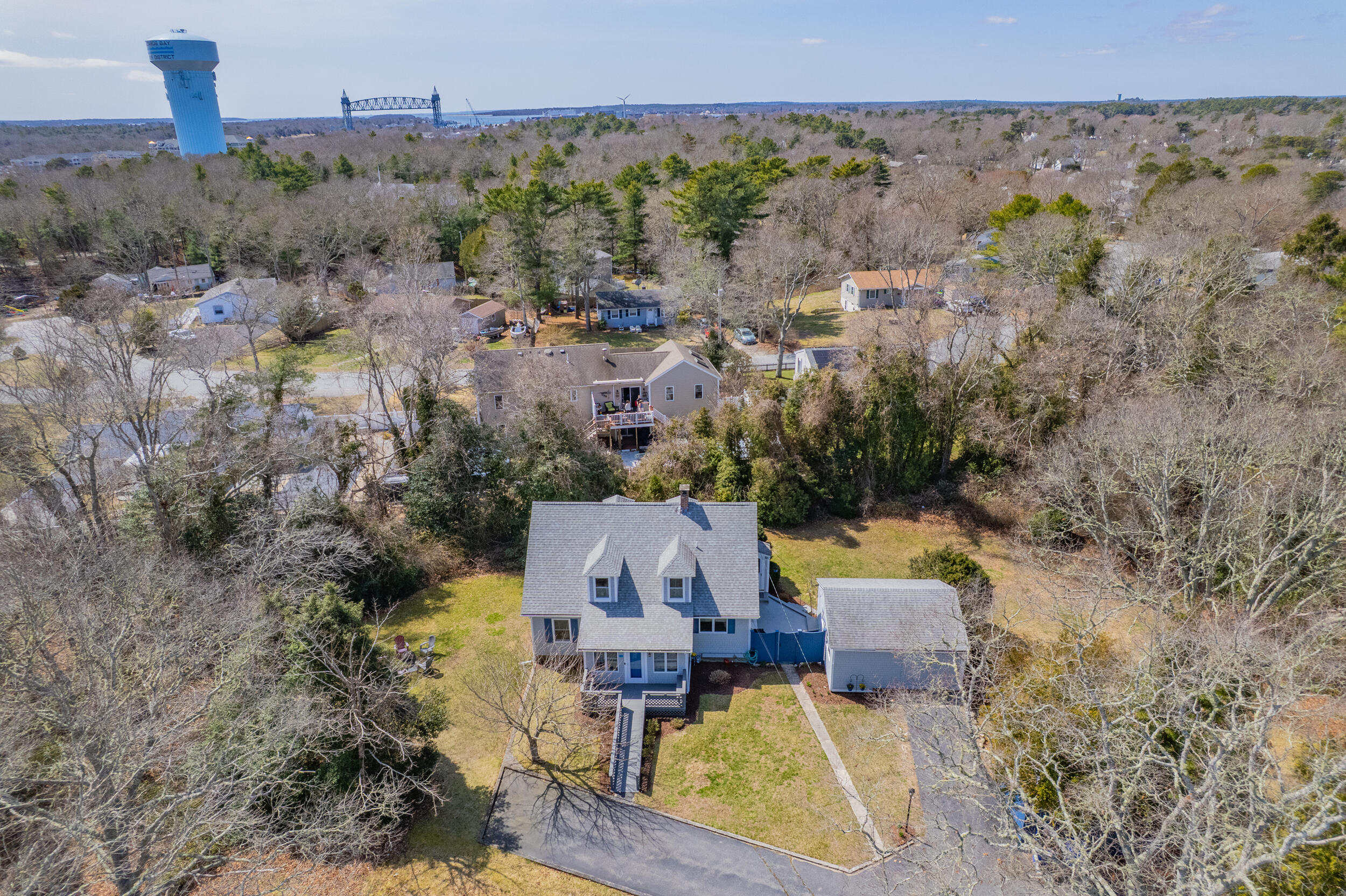 27 Head Of The Bay Road Buzzards Bay, MA 02532 - Photo 2 of 43 an aerial view of a house with a garden and lake view