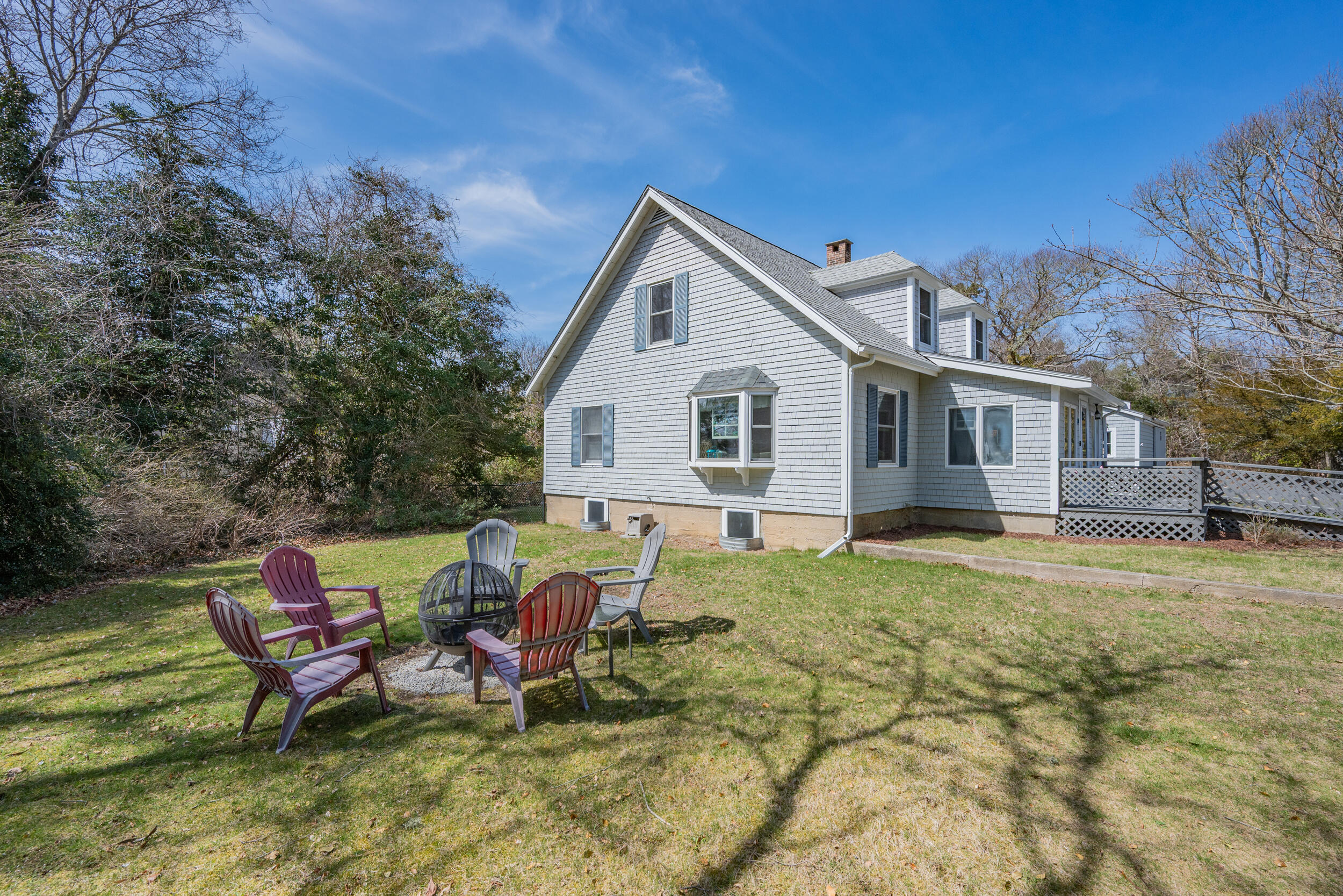 27 Head Of The Bay Road Buzzards Bay, MA 02532 - Photo 26 of 43 a view of a house with backyard and sitting area
