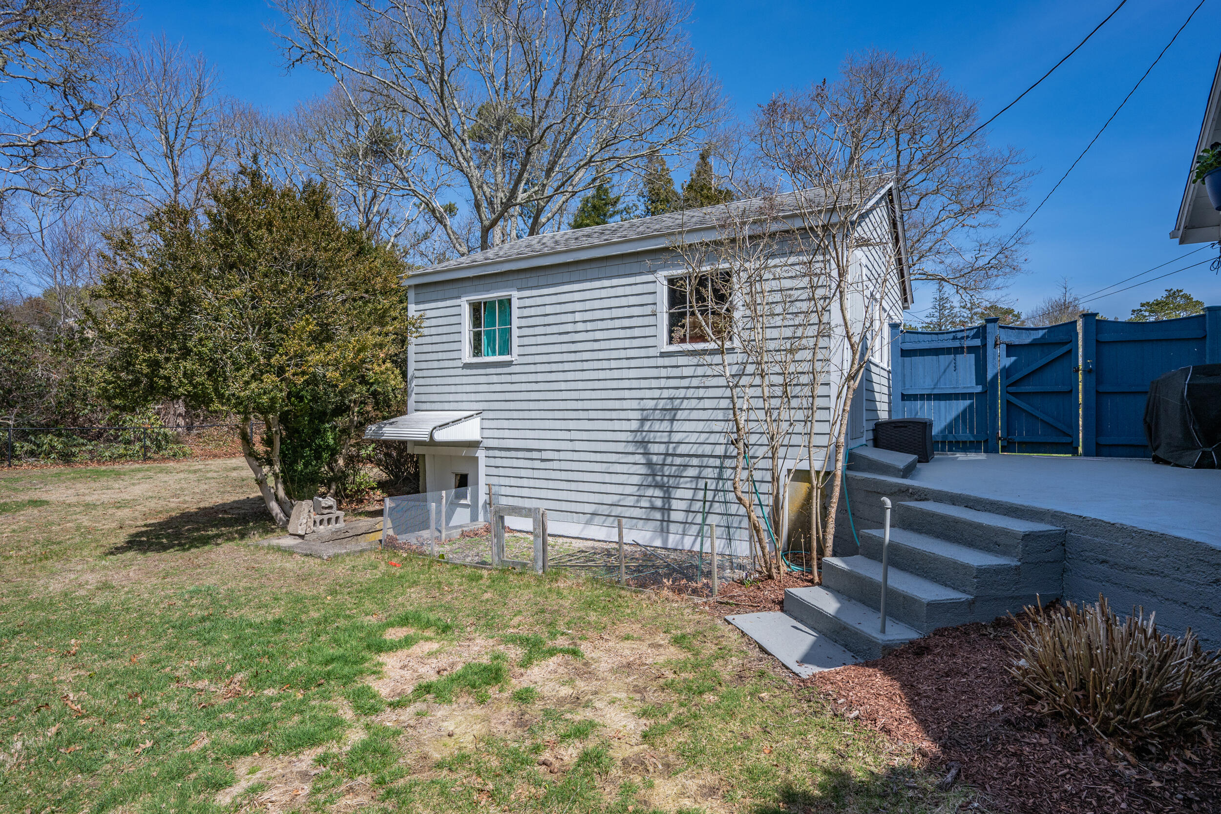 27 Head Of The Bay Road Buzzards Bay, MA 02532 - Photo 30 of 43 a view of a house with a yard