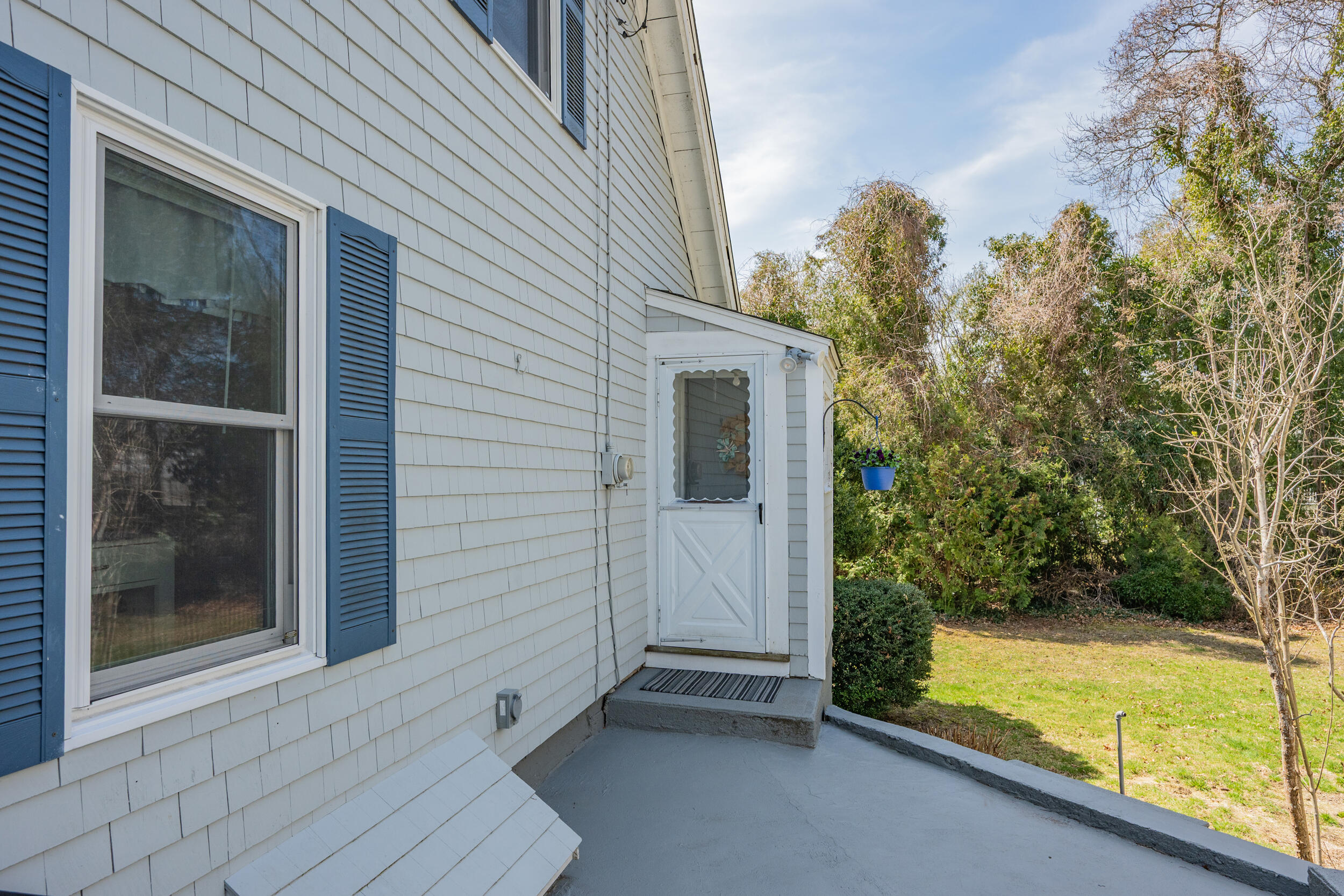 27 Head Of The Bay Road Buzzards Bay, MA 02532 - Photo 32 of 43 a view of backyard with large trees and plants