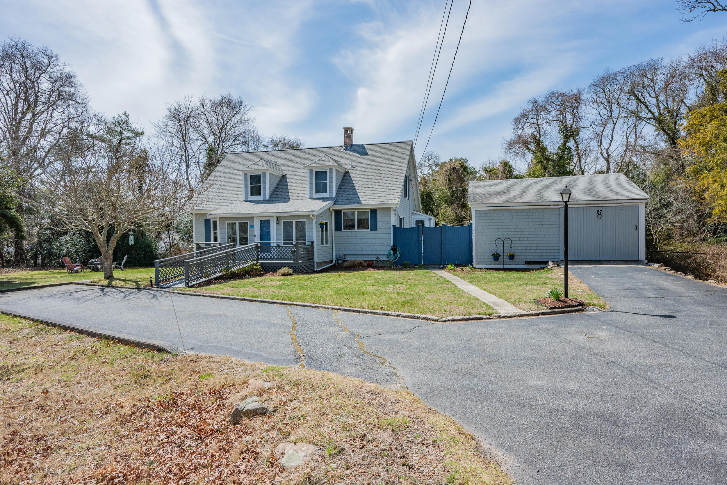 27 Head Of The Bay Road Buzzards Bay, MA 02532 - Photo 4 of 43 a view of a white house with a swimming pool