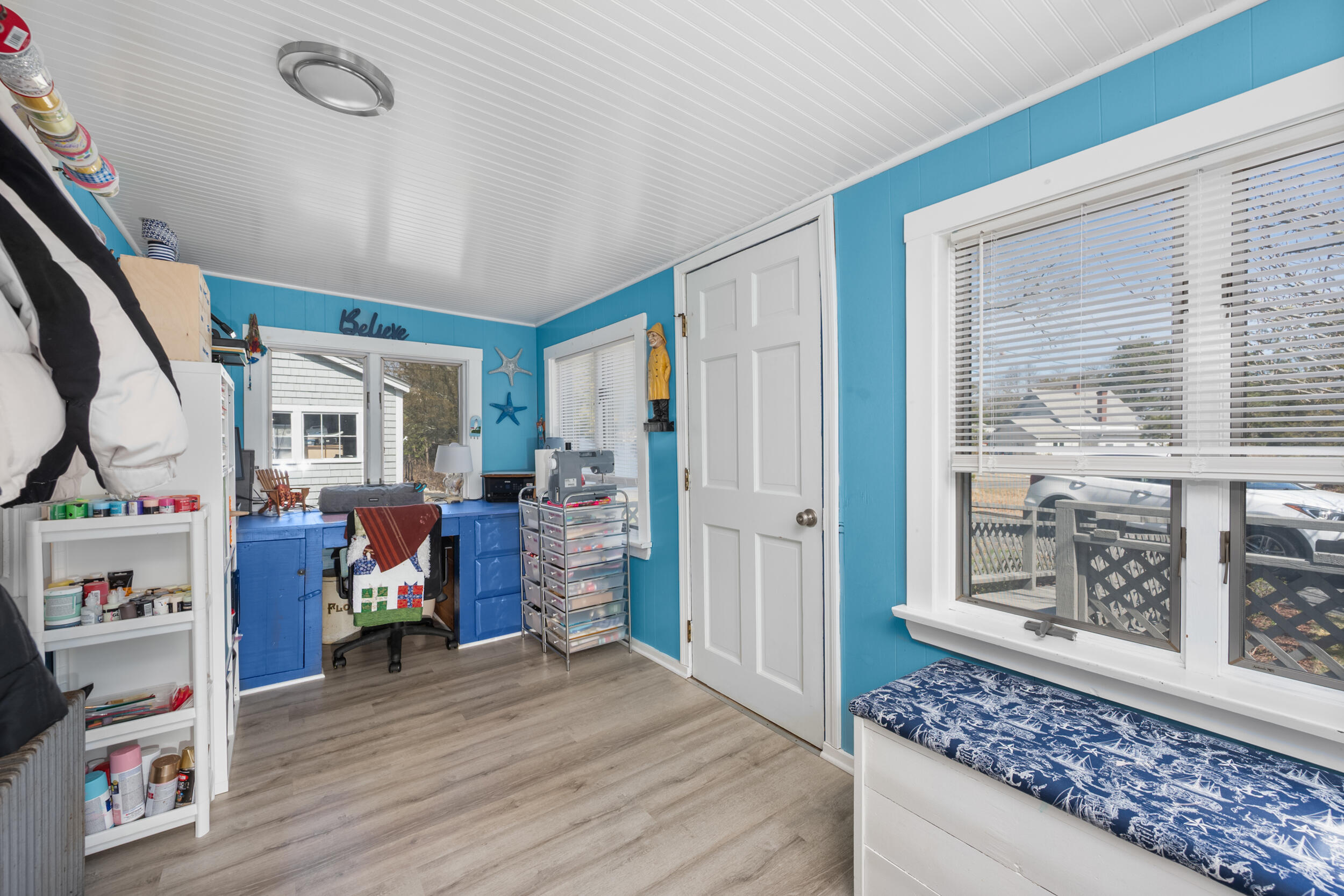 27 Head Of The Bay Road Buzzards Bay, MA 02532 - Photo 6 of 43 a view of a livingroom with wooden floor and furniture