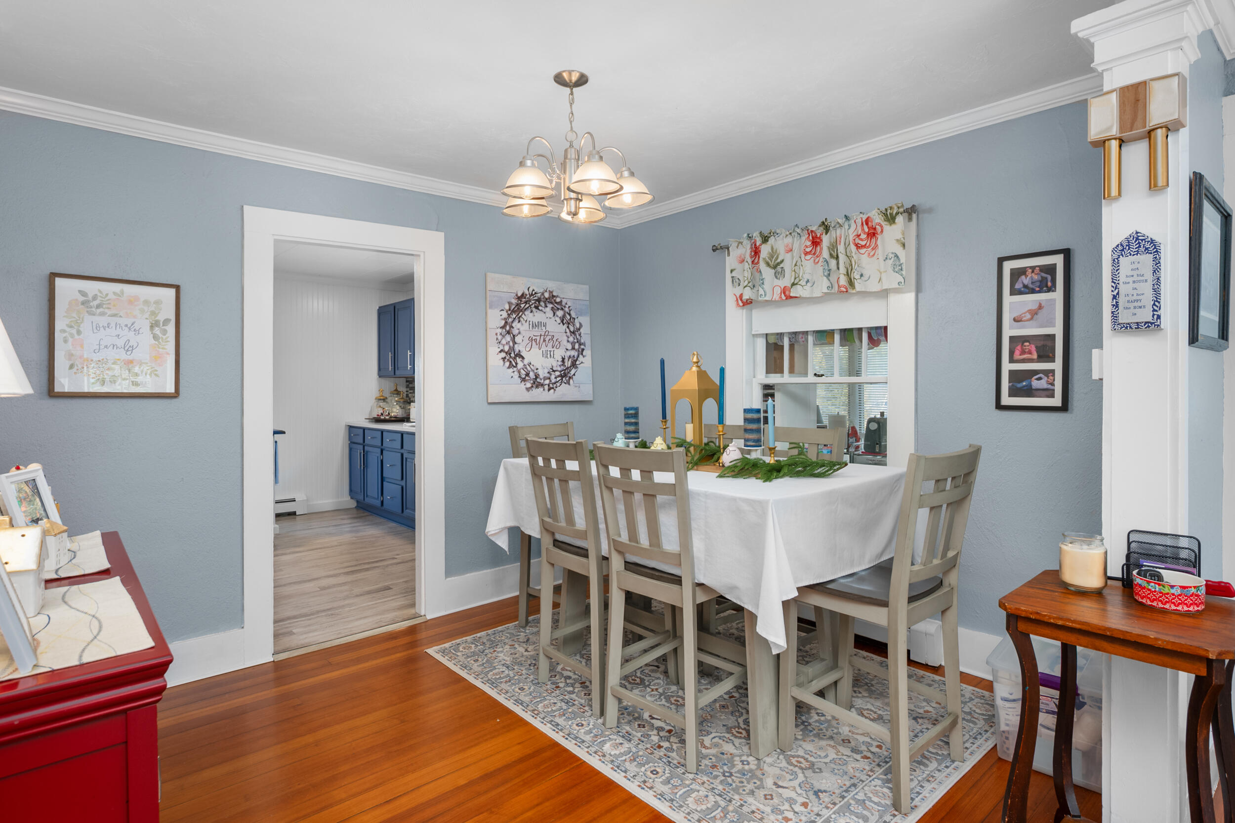 27 Head Of The Bay Road Buzzards Bay, MA 02532 - Photo 10 of 43 a view of a dining room with furniture wooden floor and a chandelier