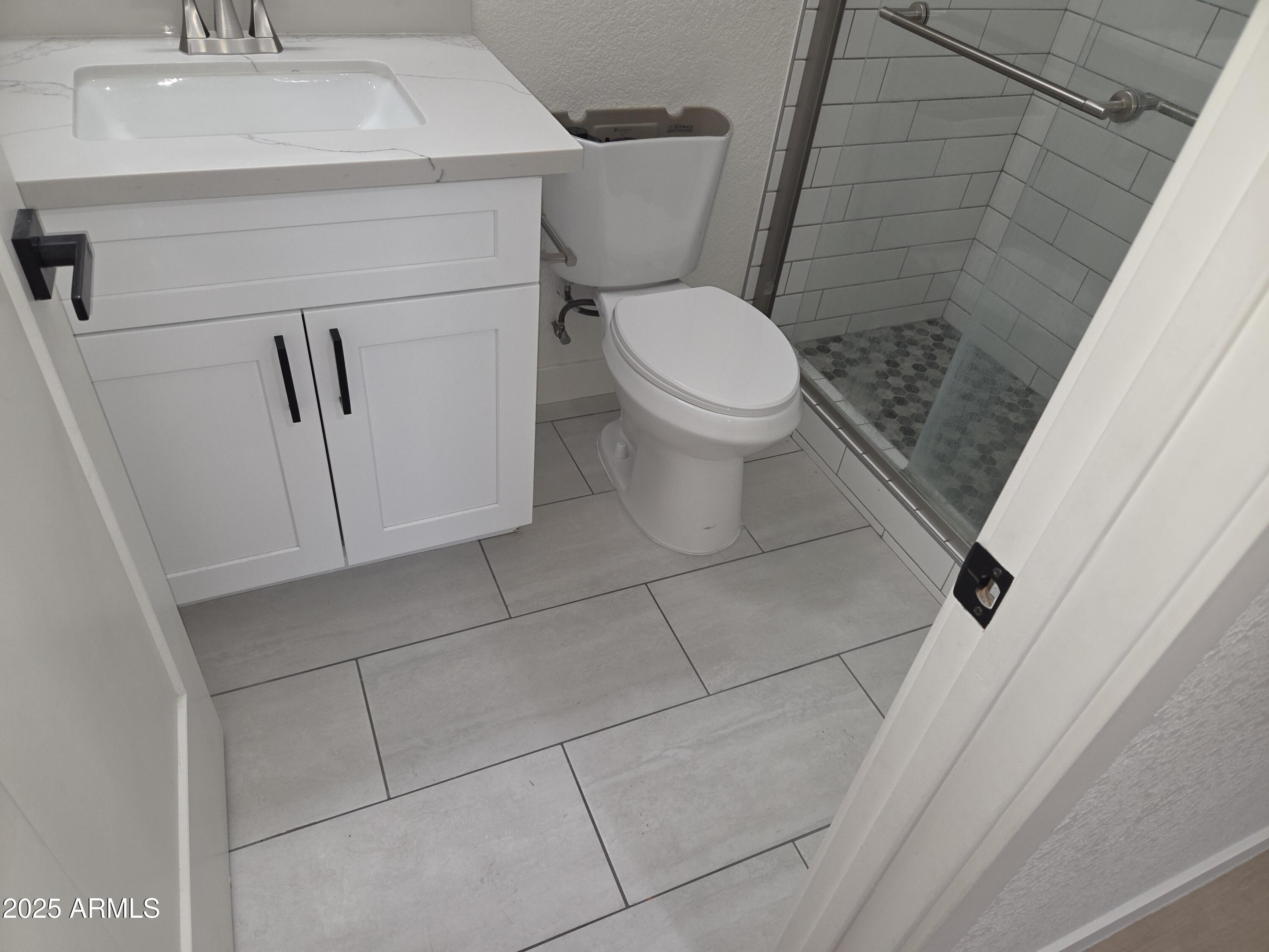 95 North Cooper Road, Unit 66 Chandler, AZ 85225 - Photo 11 of 25 a white toilet sitting next to a white sink
