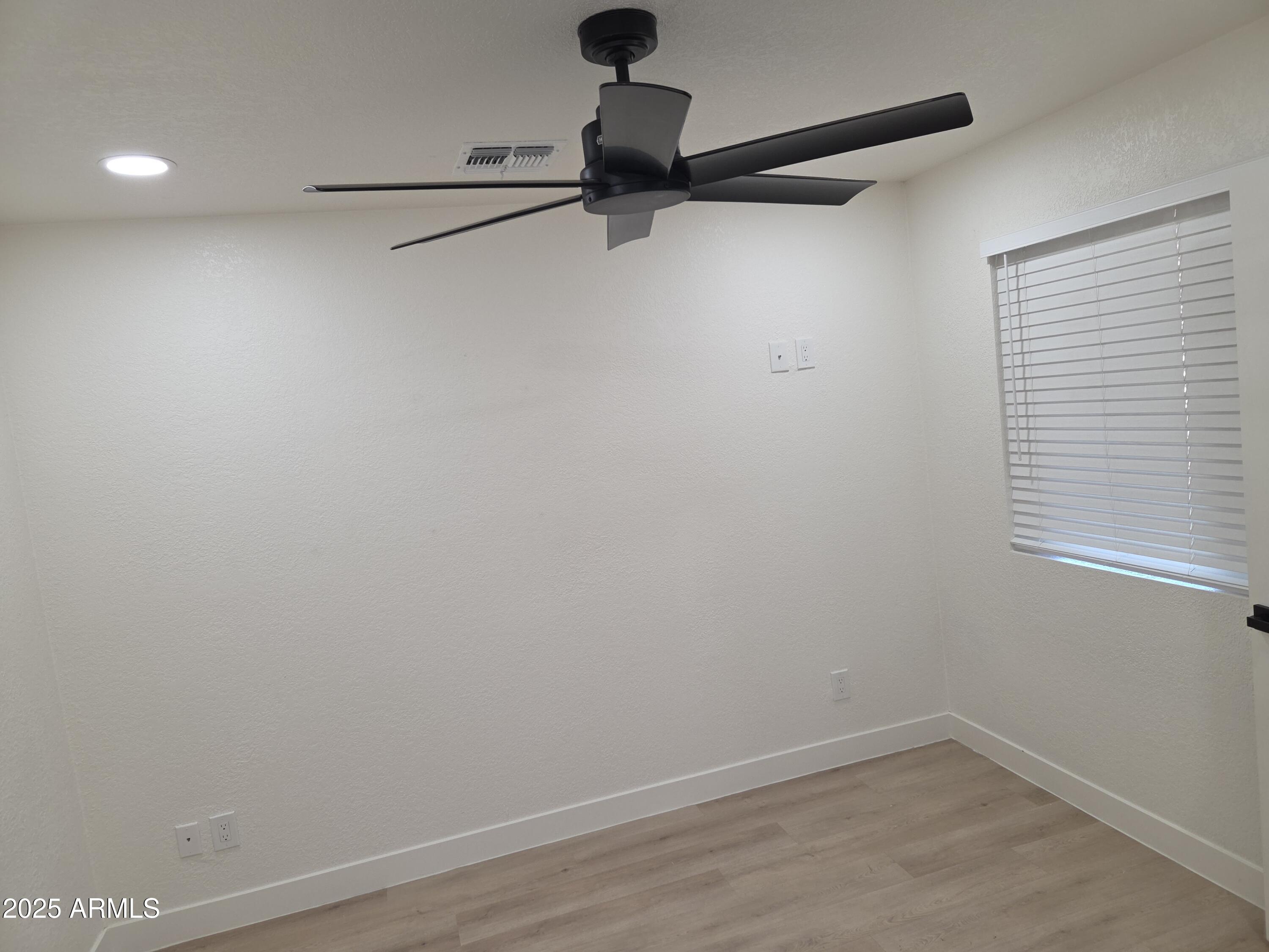 95 North Cooper Road, Unit 66 Chandler, AZ 85225 - Photo 22 of 25 a view of a room with racks on the wall