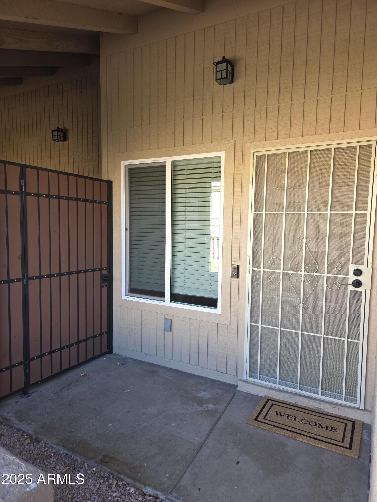 95 North Cooper Road, Unit 66 Chandler, AZ 85225 - Photo 7 of 25 a view of an empty room with a window