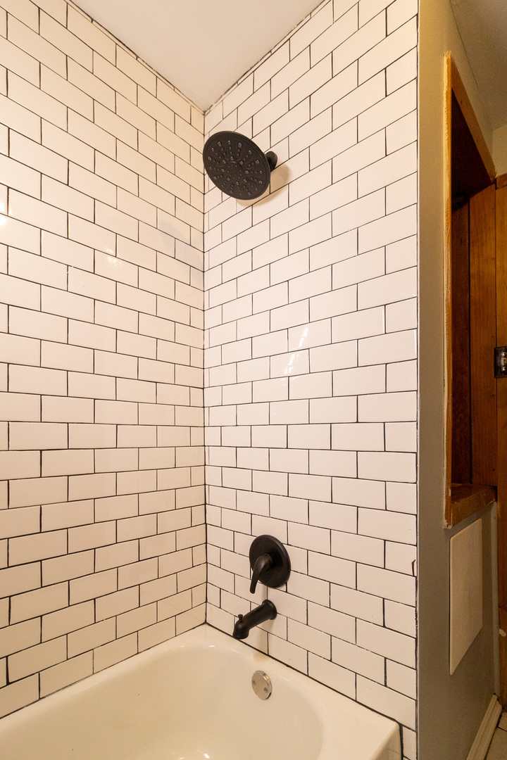 Undisclosed Address Berwyn, IL 60402 - Photo 5 of 8 a bathroom with a shower