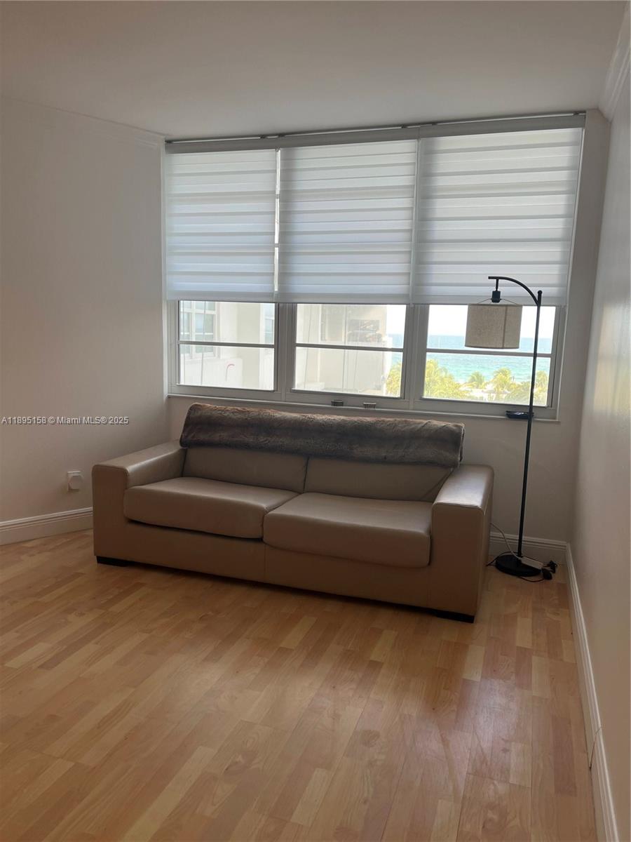 Miami Beach City Center Miami Beach, FL 33139 - Photo 12 of 15 a living room with furniture and a large window