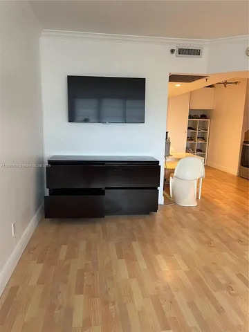 a living room with a furniture and a fireplace