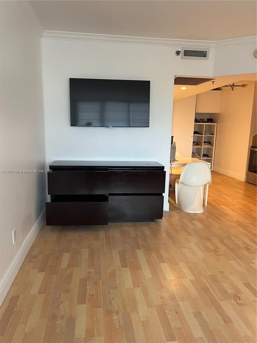 Miami Beach City Center Miami Beach, FL 33139 - Photo 13 of 15 a living room with a furniture and a fireplace