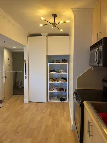 a kitchen with a refrigerator and a sink