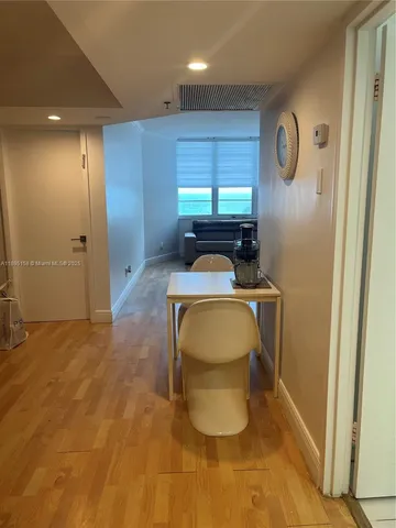 a room that has a toilet and a window in it