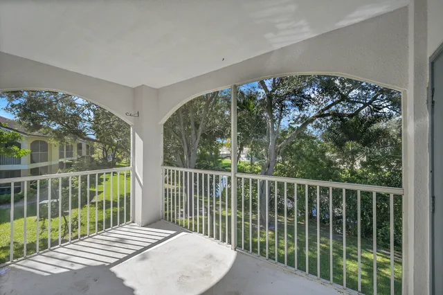 a balcony view with a garden