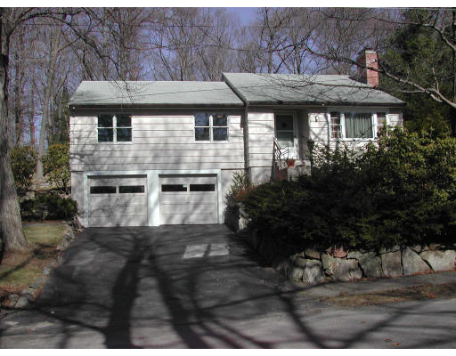 6 Massasoit Road Wellesley, MA 02481 - Photo 1 of 1 a front view of a house with a garden