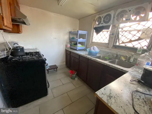 a living room with furniture rug and a window