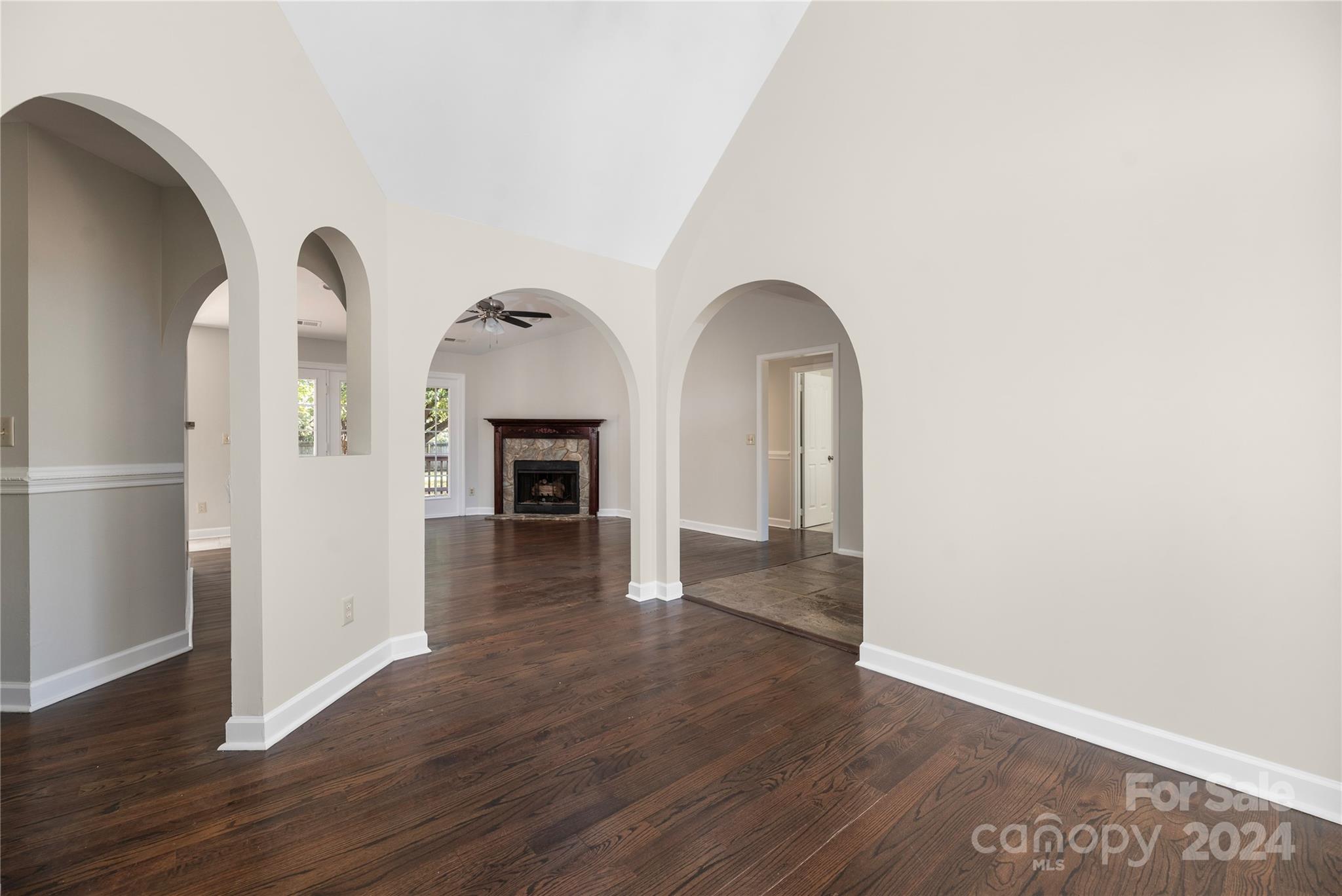 107 Planters Row Road Iron Station, NC 28080 - Photo 12 of 37 a view of a livingroom with wooden floor and a fireplace
