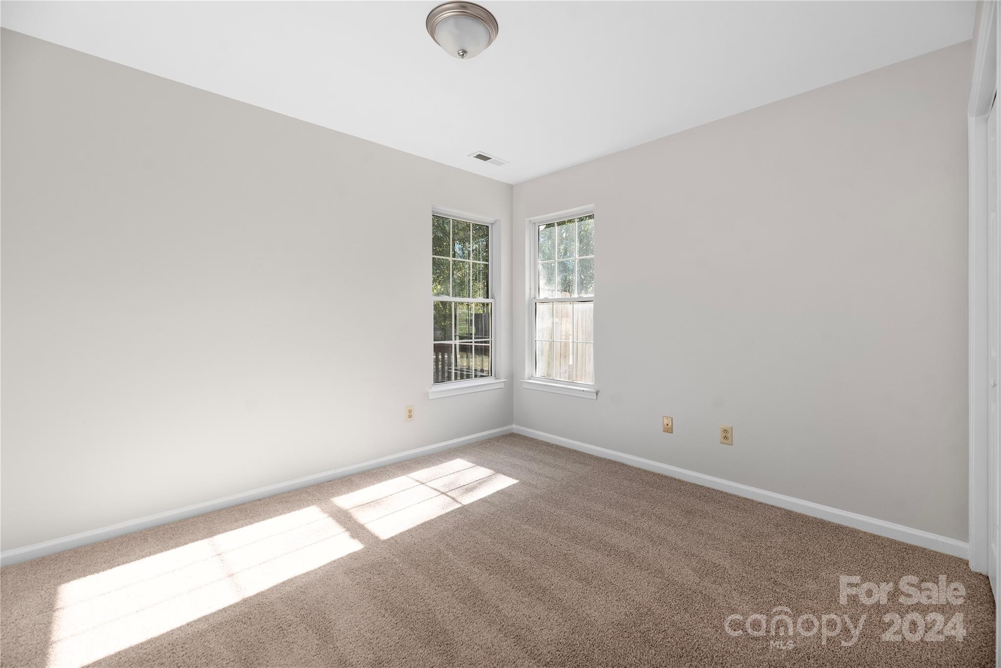 107 Planters Row Road Iron Station, NC 28080 - Photo 16 of 37 an empty room with windows