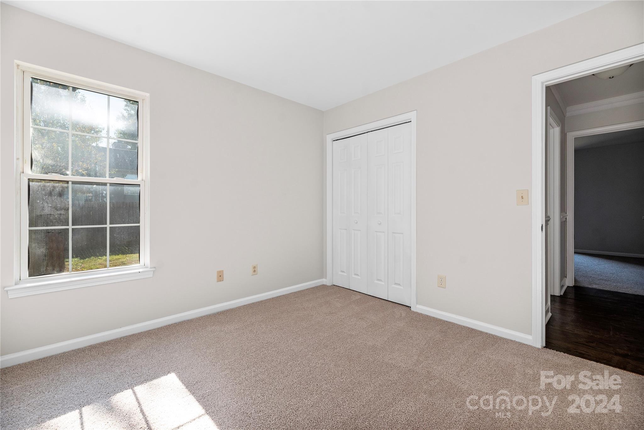 107 Planters Row Road Iron Station, NC 28080 - Photo 17 of 37 an empty room with a window