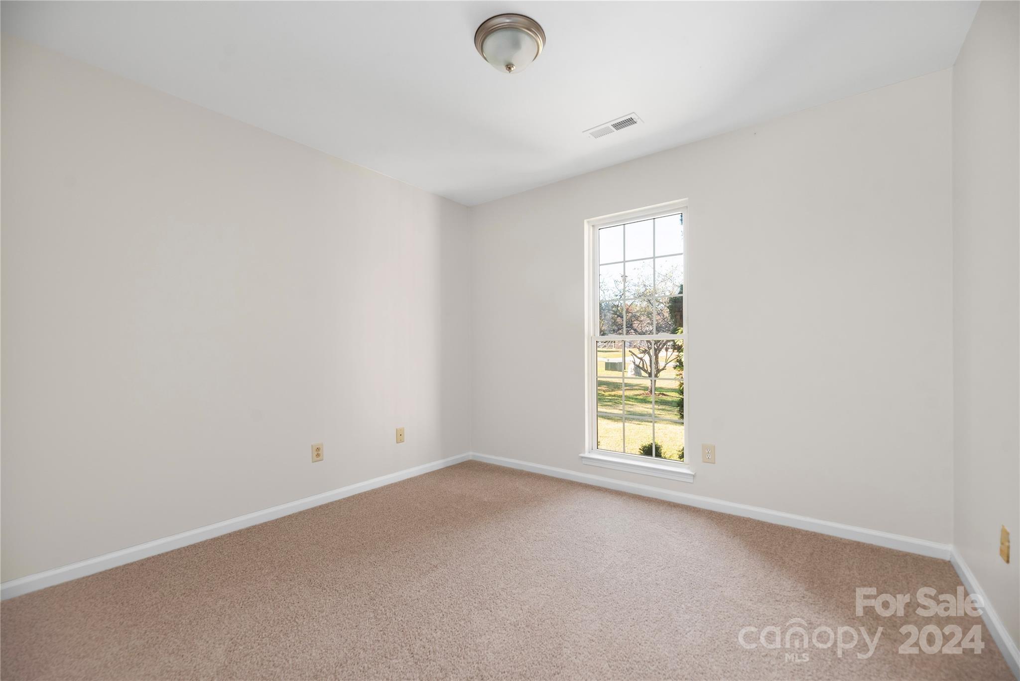 107 Planters Row Road Iron Station, NC 28080 - Photo 19 of 37 an empty room with windows