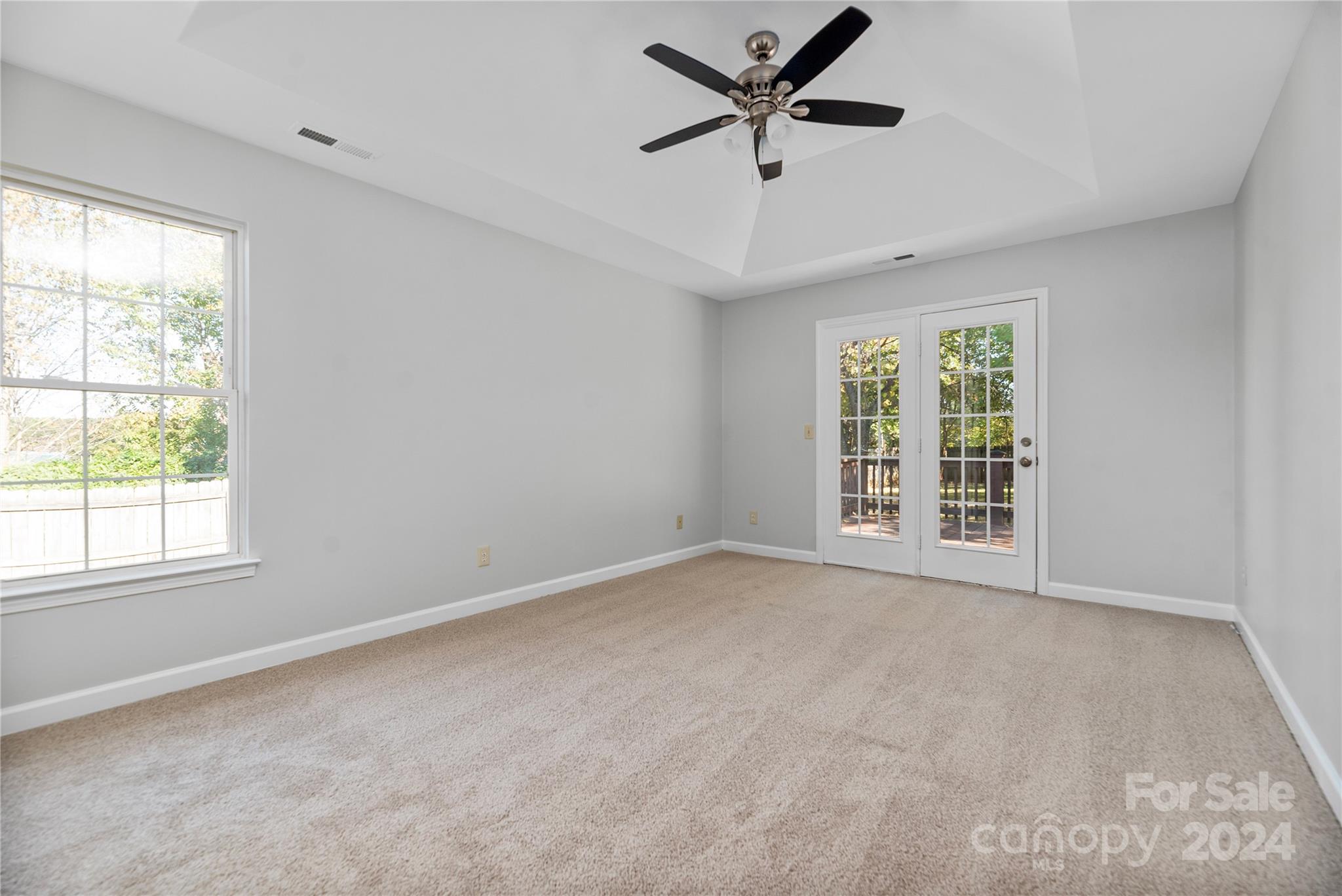 107 Planters Row Road Iron Station, NC 28080 - Photo 23 of 37 an empty room with a window and a fan