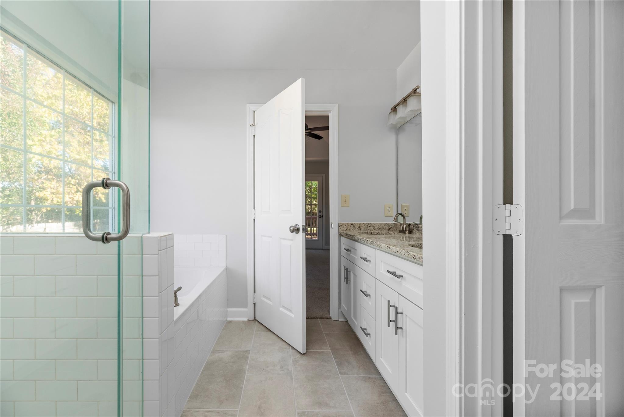 107 Planters Row Road Iron Station, NC 28080 - Photo 27 of 37 a bathroom with a double vanity sink and mirror