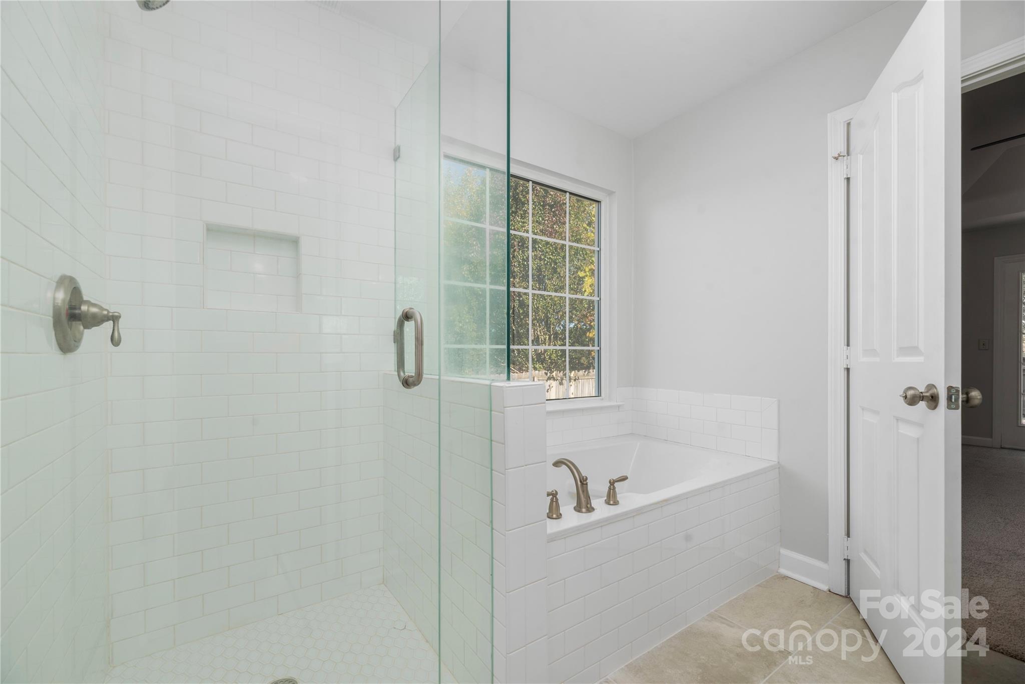 107 Planters Row Road Iron Station, NC 28080 - Photo 29 of 37 a bathroom with a tub and shower