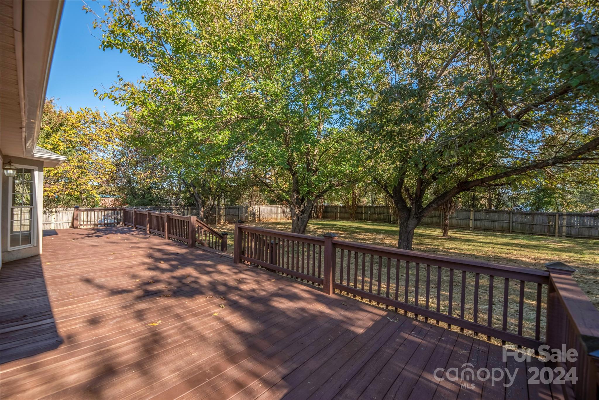 107 Planters Row Road Iron Station, NC 28080 - Photo 31 of 37 a view of a patio with wooden floor next to a yard