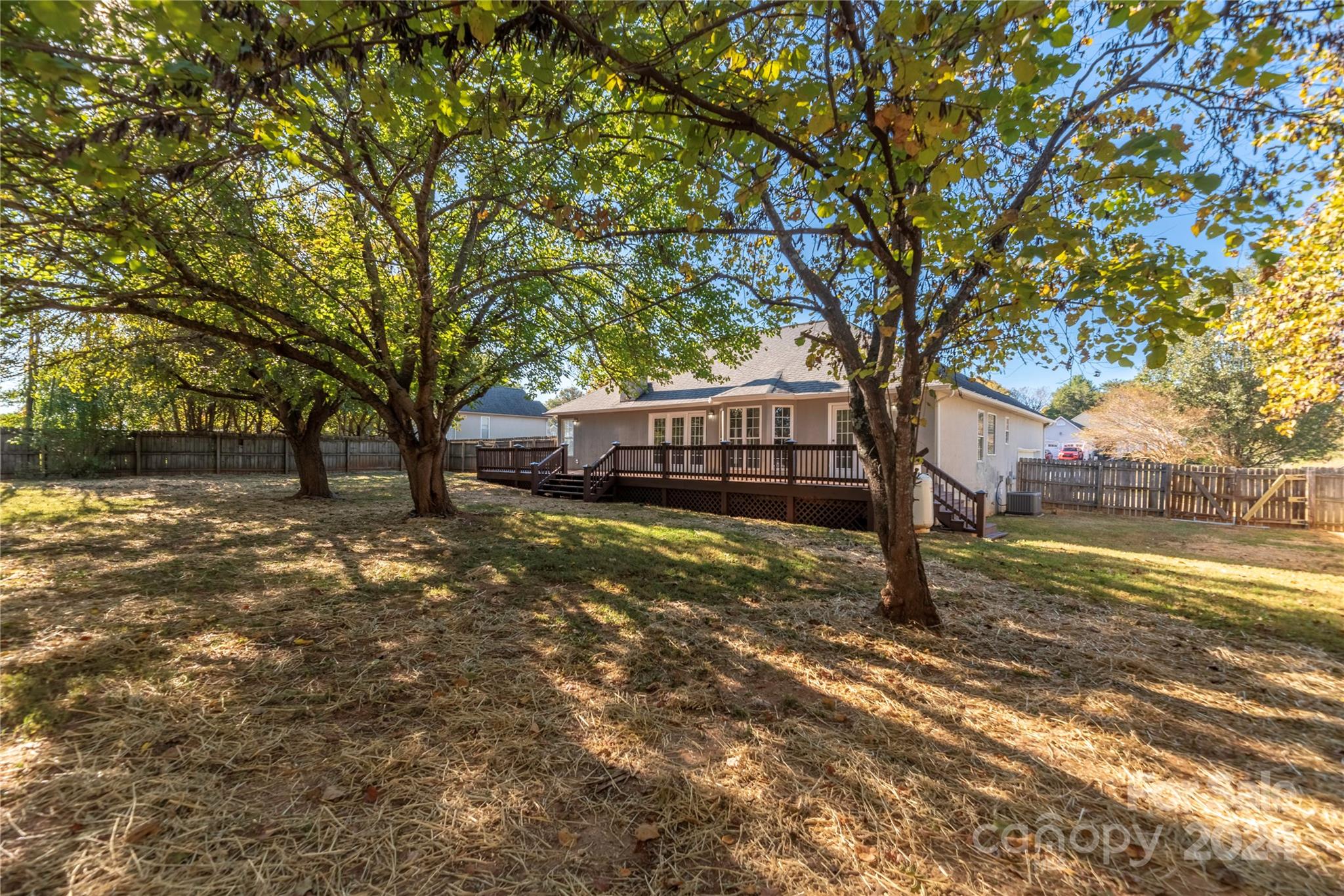 107 Planters Row Road Iron Station, NC 28080 - Photo 36 of 37 a view of a yard with a tree