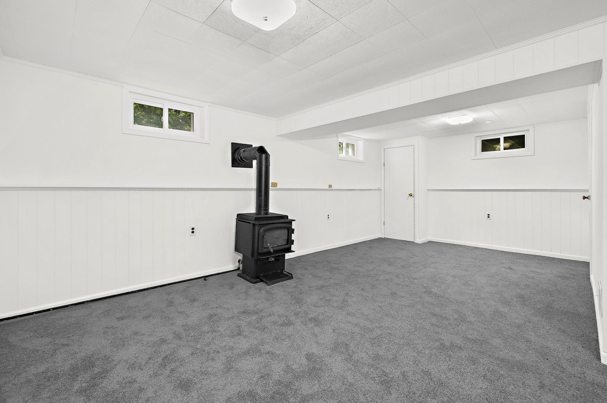 5822 Forest Hill Road Elkridge, MD 21075 - Photo 41 of 55 Cozy lower level with natural gas stove