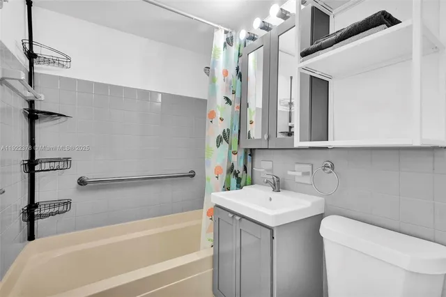 a bathroom with a sink a toilet and a bathtub