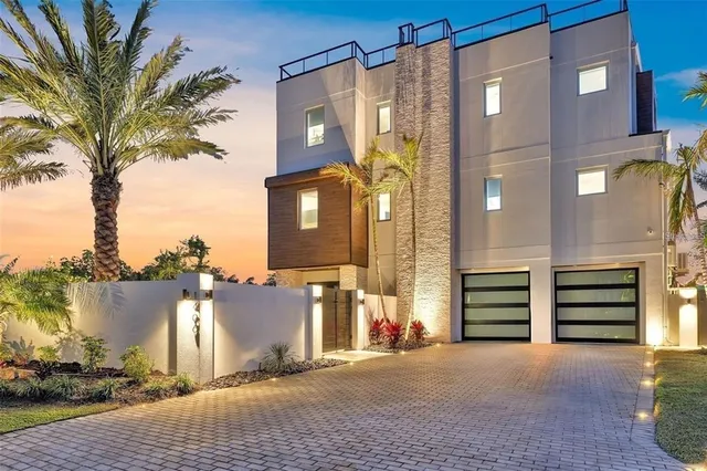 a view of a house with a backyard