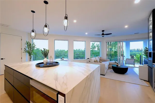 a view of balcony with couches and ocean view