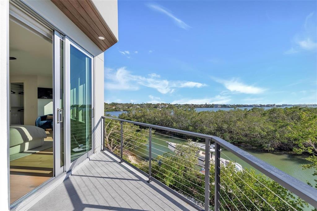 1406 Tangier Way Sarasota, FL 34239 - Photo 40 of 58 a view of balcony with couches and ocean view