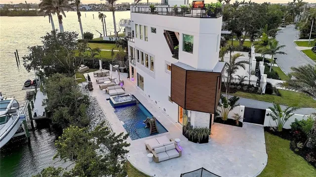 an aerial view of a house with outdoor space