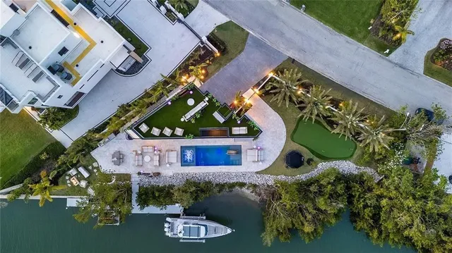 an aerial view of a house with a yard and garden
