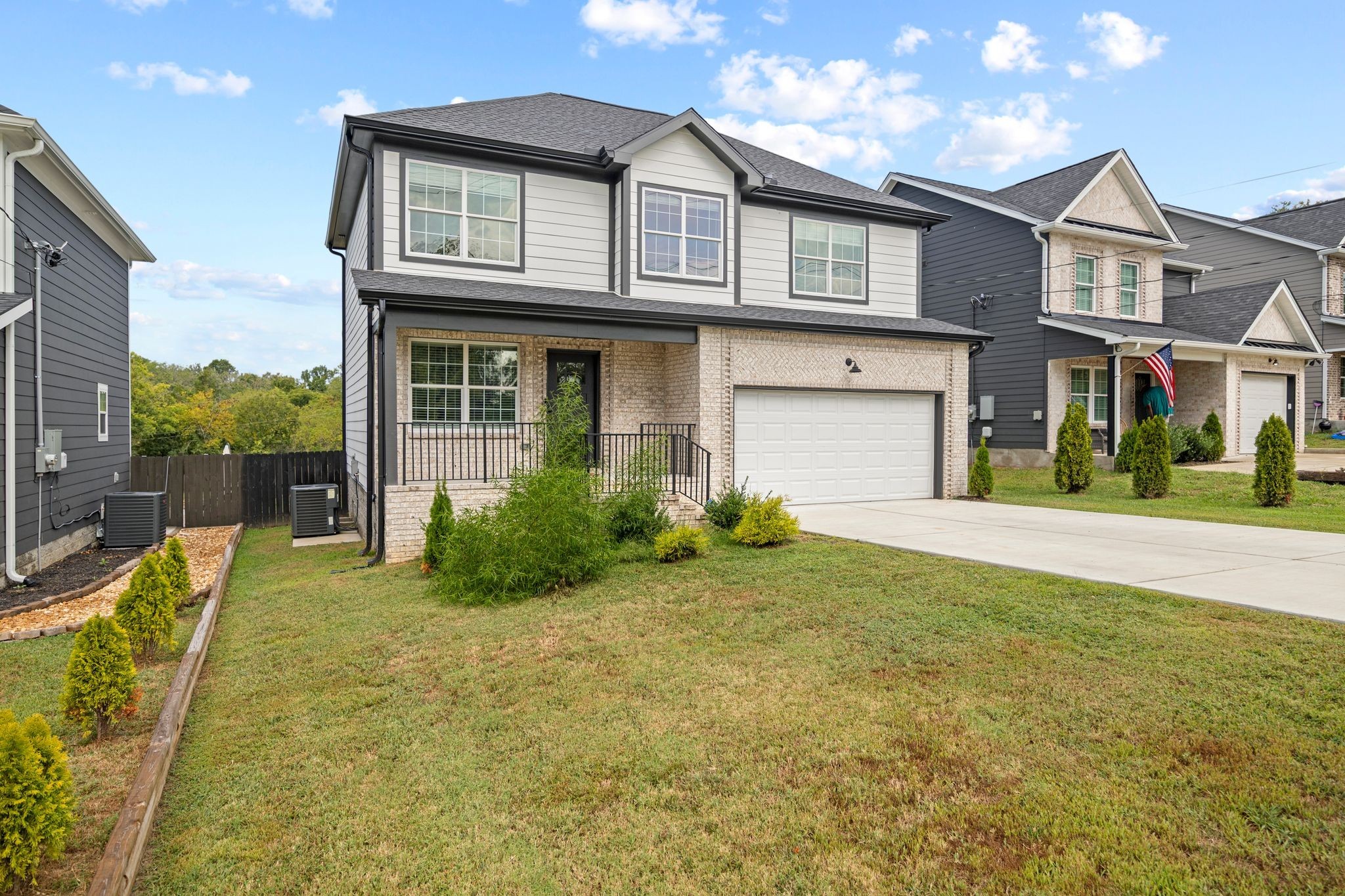 a front view of a house with garden