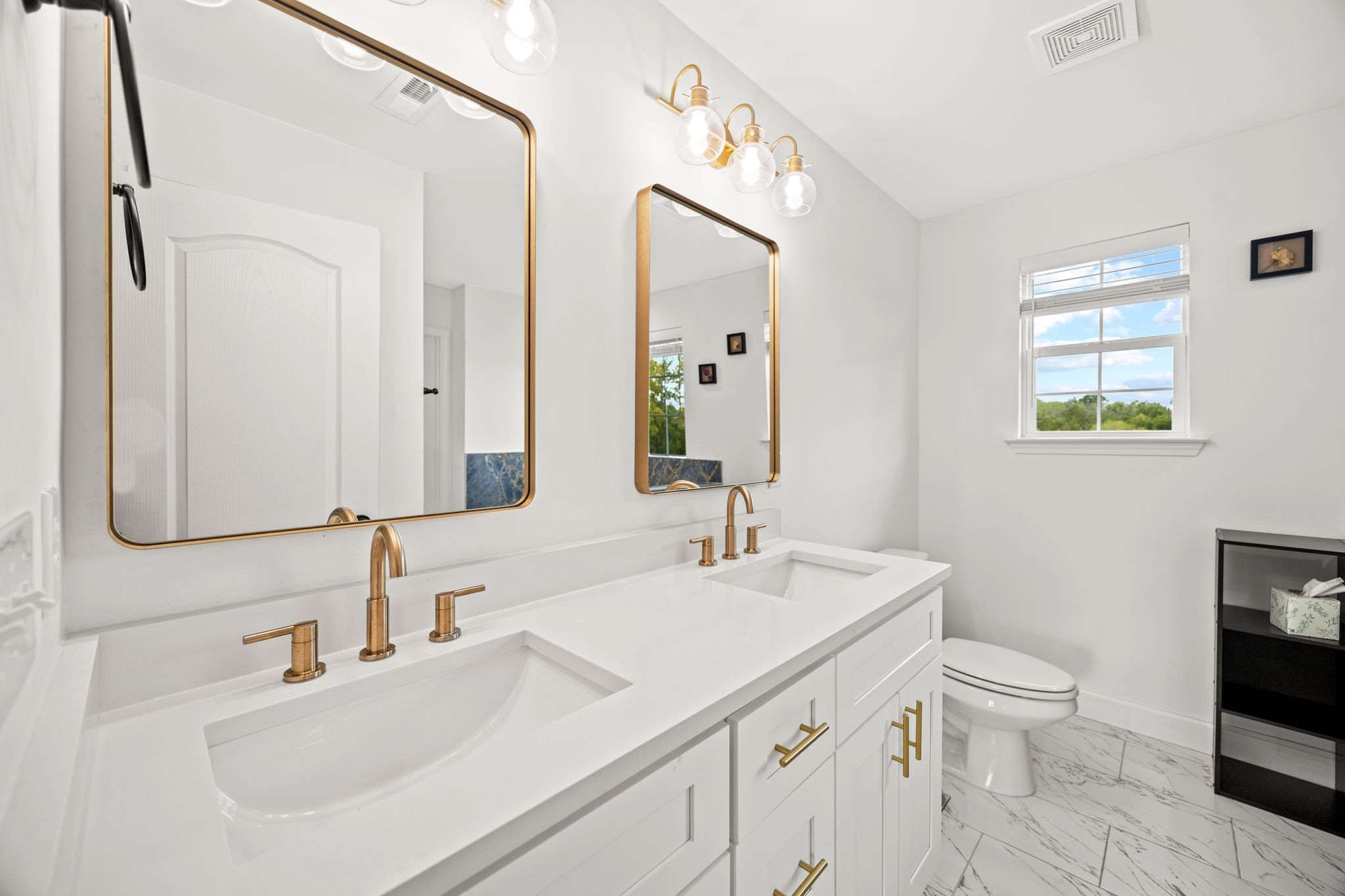 420 Larkin Springs Road Madison, TN 37115 - Photo 14 of 30 a bathroom with a sink a toilet and a mirror