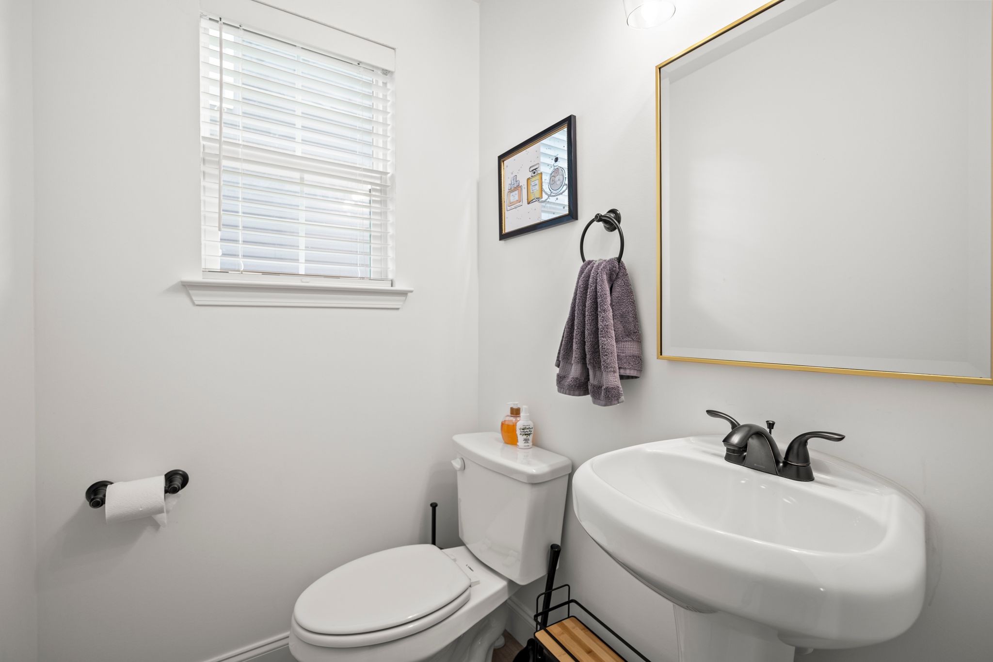 420 Larkin Springs Road Madison, TN 37115 - Photo 21 of 30 a white toilet sitting next to a bathroom sink