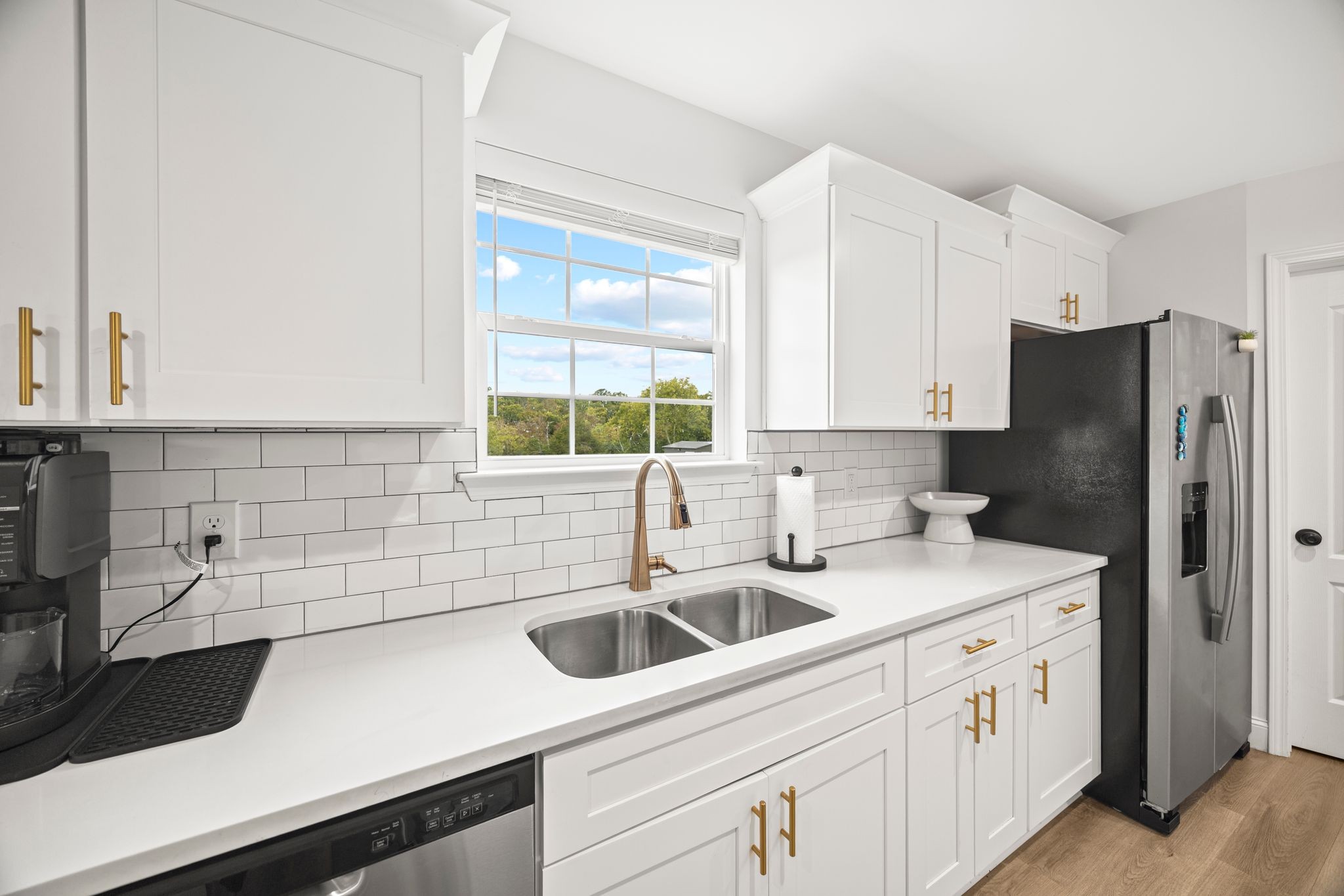 420 Larkin Springs Road Madison, TN 37115 - Photo 8 of 30 a kitchen with stainless steel appliances white cabinets and a sink