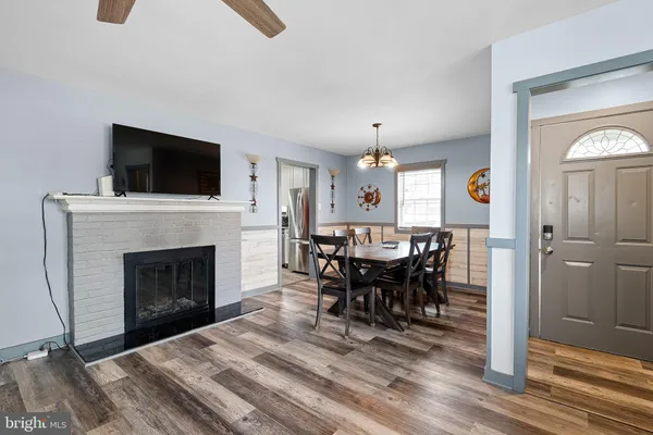 a view of a livingroom with furniture and a fireplace