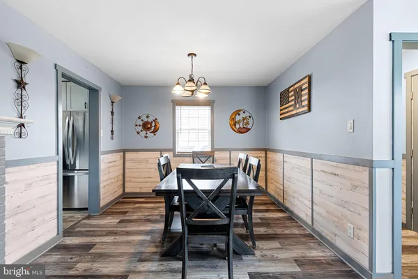 a view of a dining room with furniture and window