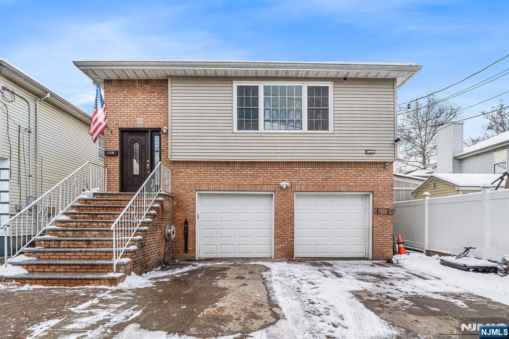 128 Baltimore Avenue Hillside, NJ 07205 - Photo 1 of 50 a front view of a house