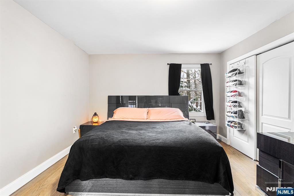 128 Baltimore Avenue Hillside, NJ 07205 - Photo 20 of 50 a bedroom with a bed and window