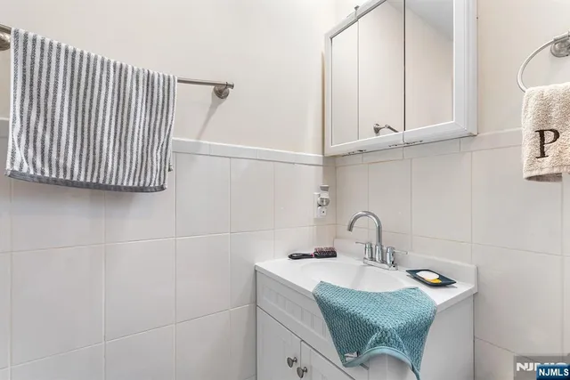 a bathroom with a sink and washing machine